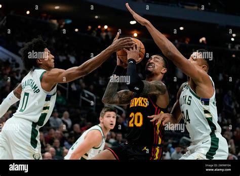 Atlanta Hawks John Collins Drives Between Milwaukee Bucks Giannis Antetokounmpo And Marjon