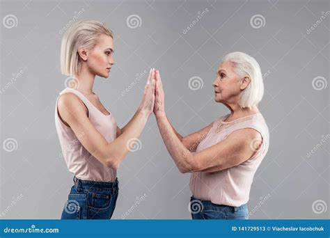 Neutral Blonde Fit Woman In Nude Shirt Attaching Her Hands Stock Image Image Of Daughter