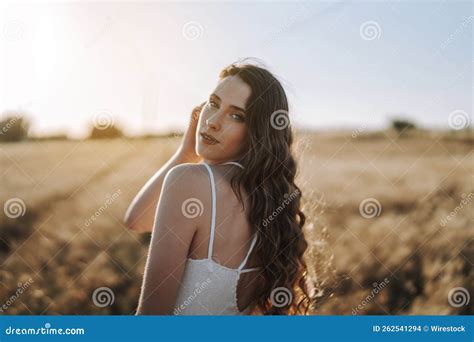 Spanish Blonde Looking Over Her Shoulder At The Camera With The Sun