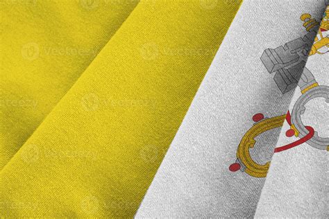 Vatican City State flag with big folds waving close up under the studio