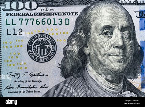 Close up overhead view of Benjamin Franklin face on 100 US dollar bill ...
