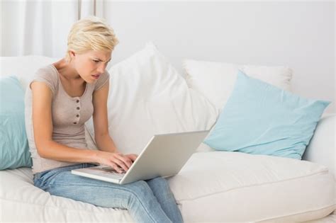 Premium Photo Angry Blonde Woman Using Her Laptop