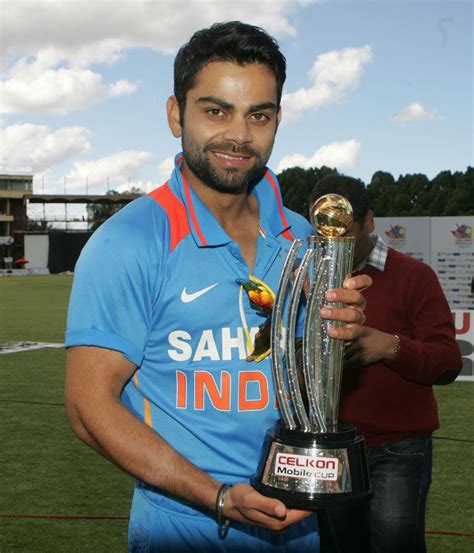 Virat Kohli with the trophy | Virat and anushka, Virat kohli, Banner ...
