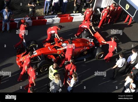 Ferrari S Pit Stop Crew Working Around The Ferrari Formula One At The