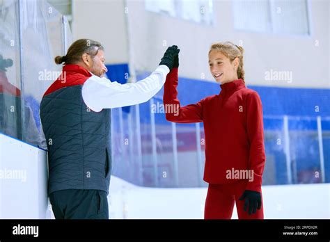 Success Figure Skating Trainer Coach Cheering His Student Girl