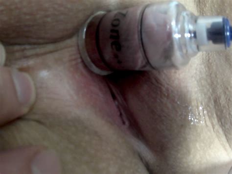 Kinky Brunette Chick Having Some Fun With A Pump Photos