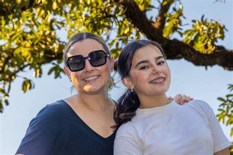 Aunt And Niece Posing As Models Outdoors Stock Photo Image Of Brunette Girl 323824406
