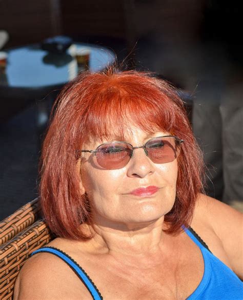 Pretty Mature Woman Relaxing Enjpying The Sun Stock Photo Image Of Glasses Passenger