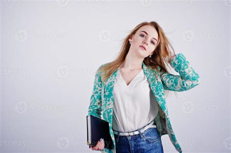 Stylish Blonde Girl In Jacket And Jeans With Notebook Diary At Hands Against White Background On