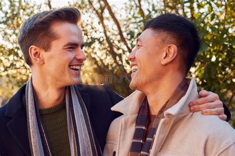 Loving Same Sex Male Couple In Bed At Home Drinking Hot Drink Together Stock Image Image Of