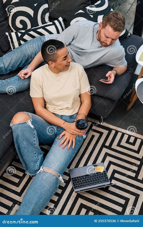 Happy Multiracial Couple Enjoying Spending Time Together Drinking