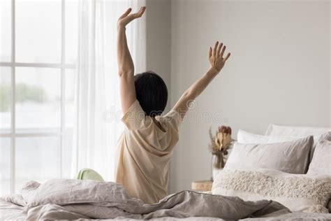 Rear View Mature Woman Awakening In The Morning In Bedroom Stock Photo Image Of Enjoy