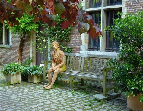 Statue Man Sitting On Bench National Botanical Garden In Town Of Meise