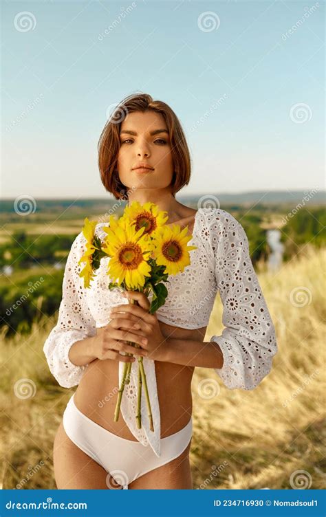 Woman In Lingerie Poses With Flowers In The Field Stock Photo Image Of People Freedom