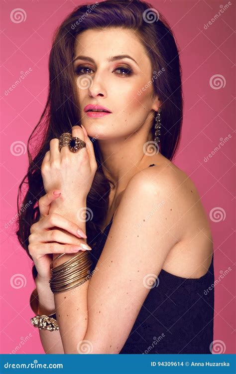 Portrait Of Woman With Long Brunette Curly Hair Studio S Stock Photo Image Of Looking