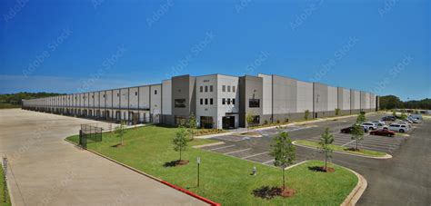 Modern Gray Industrial Distribution Warehouse And Parking Lot Stock