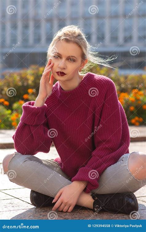 Pretty Blonde Model Wearing Red Oversize Sweater Sitting On The Stock Photo Image Of Model