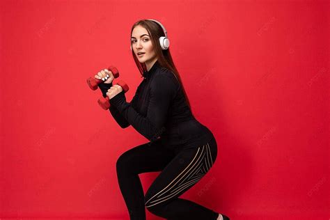 Brunette Woman Doing Fitness With Dumbbells And Earphones Photo Background And Picture For Free
