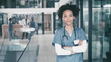 Hospital Face And Confident Nurse With Smile Arms Crossed And