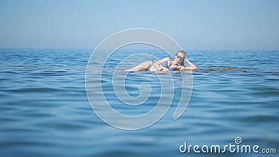 Girl In Blue Bikini Having Fun Lying On The Beach In The Waves Stock Footage Video Of Rest