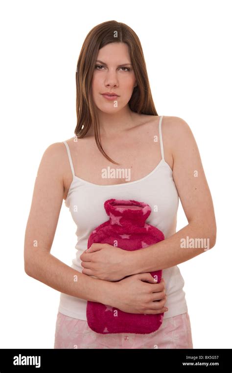 Brunette Woman Holding A Hot Water Bottle With Period Pains Stock Photo Alamy