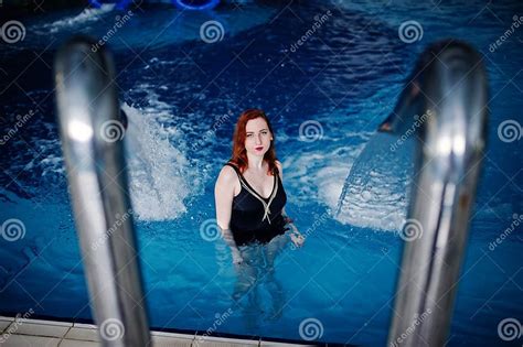 Red Haired Girl In Black Swimsuit Having Rest In Swimming Pool Of Aqua Park Stock Image Image