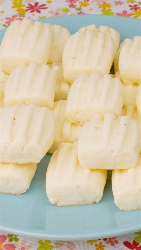 Several Pieces Of White Chocolate On A Blue Plate