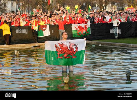 Wales Rugby Fans With Welsh Red Dragon Flags Celebrate After An