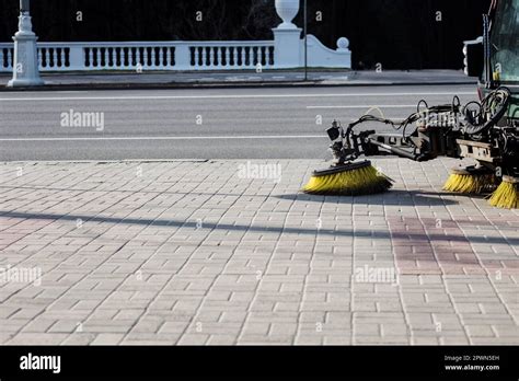 Brushs of street cleaning machine on street. Vehicle sweeping the ...