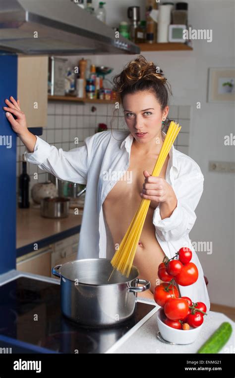 Nude Woman Cooking Spaghetti Stock Photo Alamy