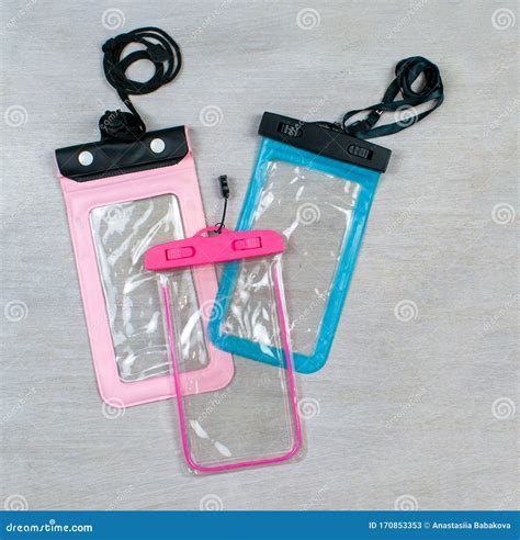 Waterproof Phone Bags Cases Covers Isolated On Wood Background