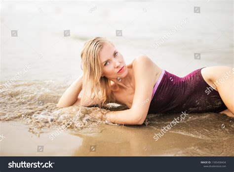 Seductive Blonde Woman Lying On Beach Stock Photo Shutterstock