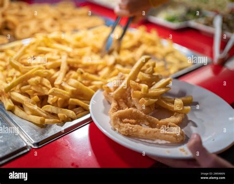 Boy Hands Taking French Fries For Lunch On Buffet Restaurant Stock