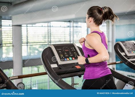 Fti Brunette Running On Treadmill Stock Photo Image Of Indoors Beautiful