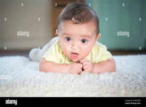 Baby Lying On His Stomach Stock Photo Alamy