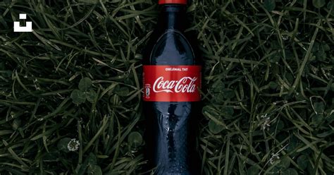 Coca Cola Soda Bottle On Grass Photo Free Coke Image On Unsplash