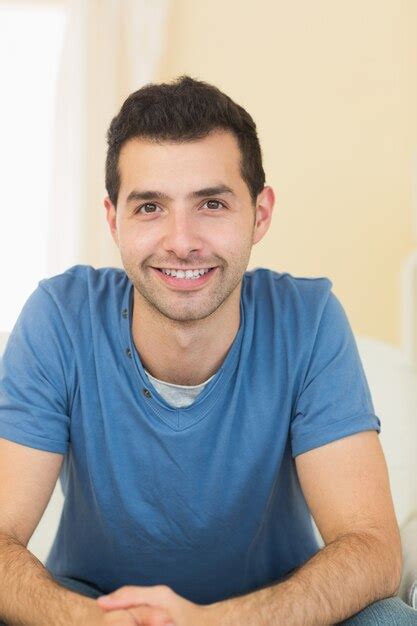 Premium Photo Casual Smiling Man Relaxing On Couch