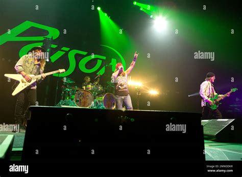 C.C. DeVille, left, Rikki Rockett, Bret Michaels and Bobby Dall of the band Poison perform in ...