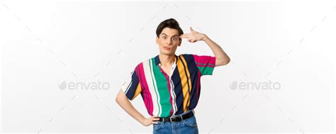 Annoyed Gay Man Making Finger Gun Sign Shooting Hismelf From Irritation And Boredom Standing