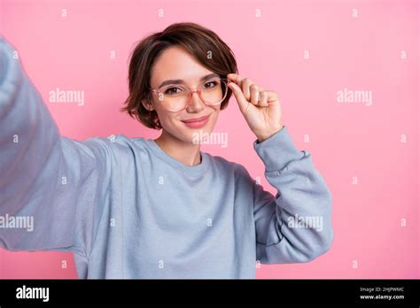 Photo Of Cool Millennial Brunette Lady Do Selfie Wear Blue Pullover Spectacles Isolated On Pink