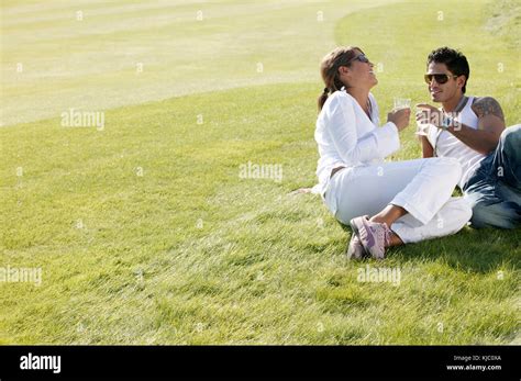Couple Relaxing Outdoors Stock Photo Alamy