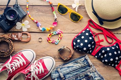 Premium Photo Beauty Colorful Bikini And Accessories On Wooden Floor