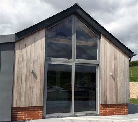 Aluminium Sliding Doors And Composite Windows In Converted Barn In