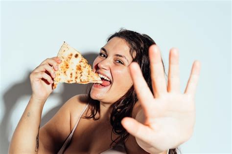 Premium Photo Plus Size Woman Posing In Studio In Lingerie