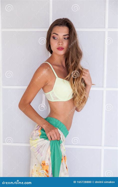 Portrait Of A Beautiful Fashionable Woman In Lingerie In Bedroom Style