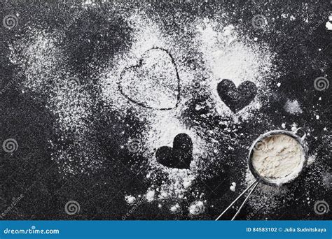 Baking Background With Flour And Heart Shape On Kitchen Black Table