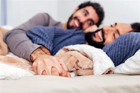 Premium Photo Hands Of Couple Of Gay Men Intertwined On The Bed