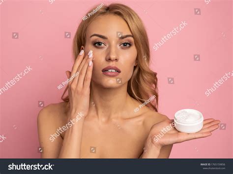 Model With Dark Blonde Hair Applying Conditioner To Hair Images Stock Photos And Vectors