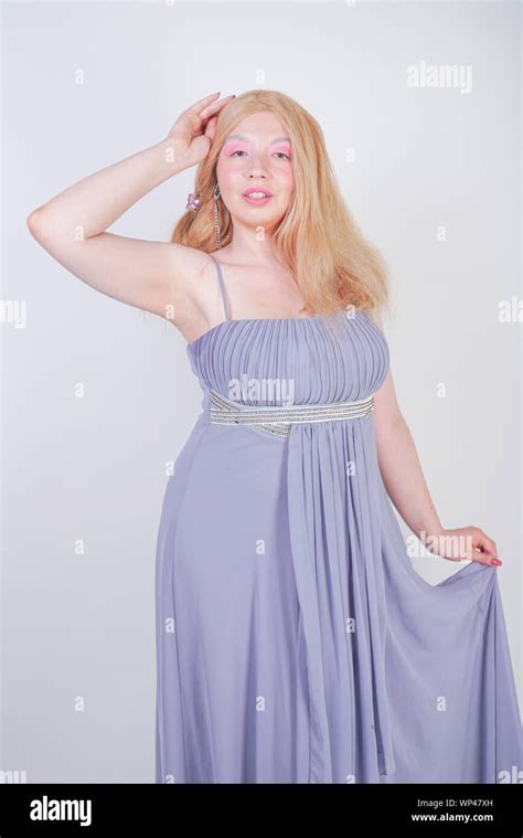 Cute Fashion Lady With Asian Face And Blonde Hair In Gray Dress Stock