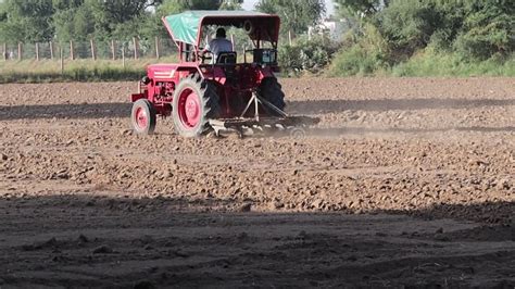 A Farmer is Plowing Wooden Plough in His Field. Stock Video - Video of ...